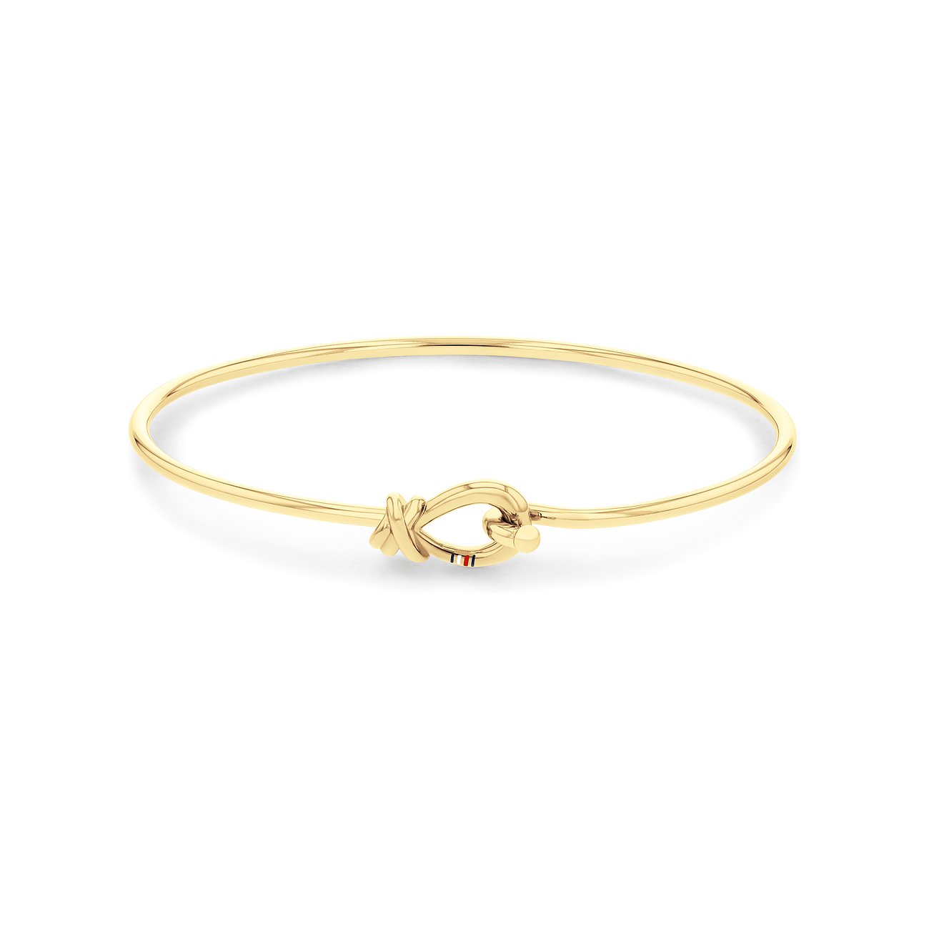 Ein zartes Tommy Hilfiger Armband aus goldfarbenem Edelstahl, das einen dekorativen Knoten als Verschluss hat.