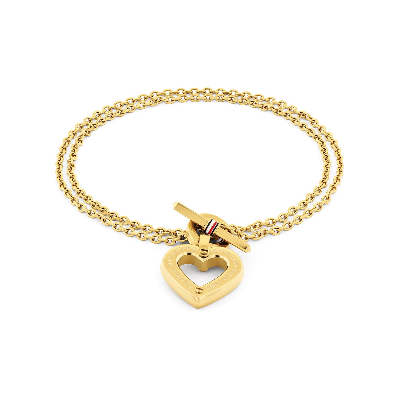 Tommy Hilfiger Armband aus goldfarbenem Edelstahl mit doppeltem Herzanhänger und Knebelverschluss auf weißem Hintergrund.