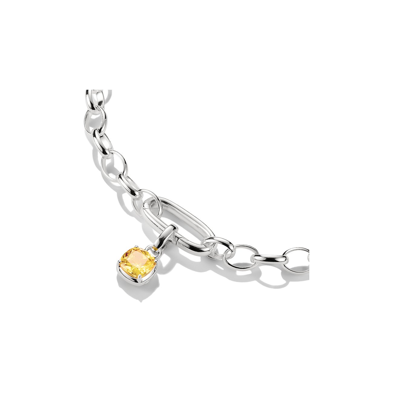Bracciale Thomas Sabo in argento a maglie con ciondolo zircone giallo, fissato in basso a sinistra su una maglia allungata.