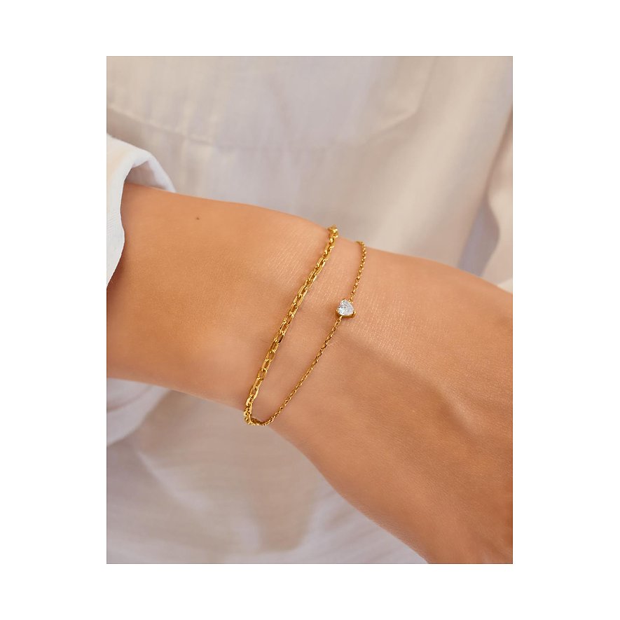 Een delicaat, zilveren Ania Haie armbandje met kleurstaal zirkonia, kunstig bewerkt met een hartgeslepen design.