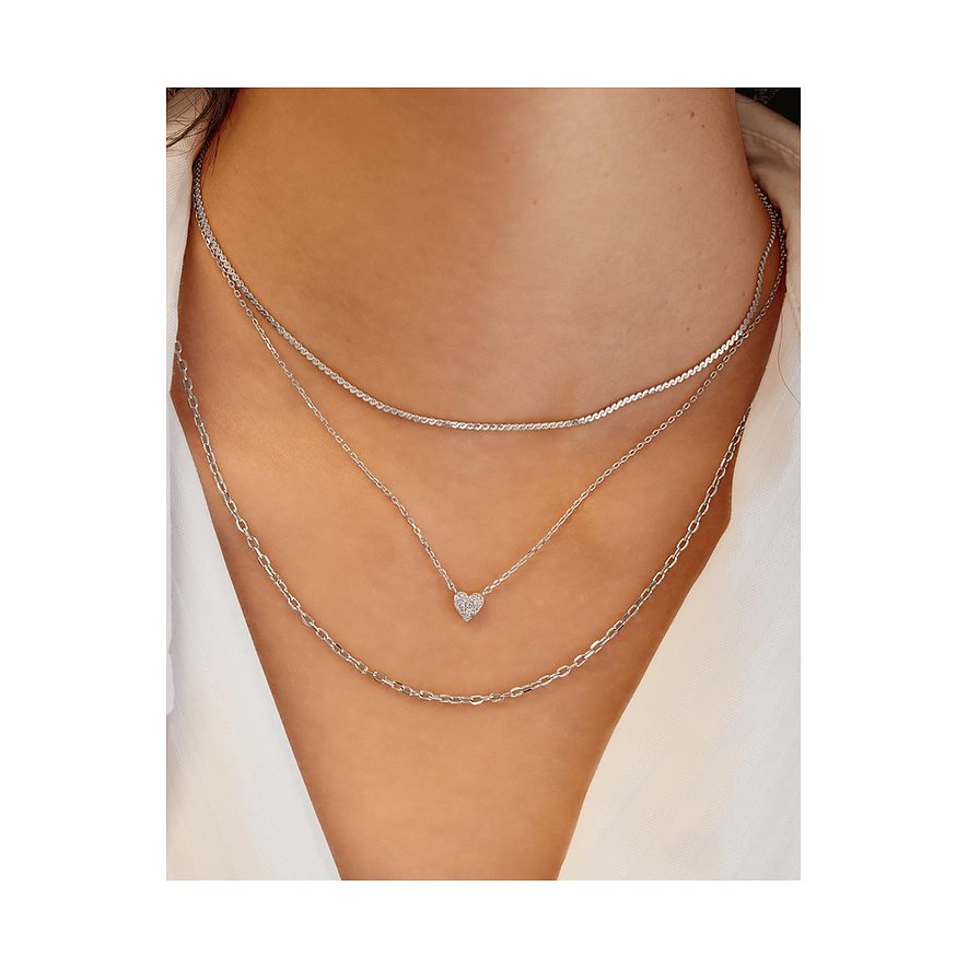 Ania Haie 925 zilveren drielaagse ketting. De middelste ketting heeft een sprankelende zirkonia hart hanger.