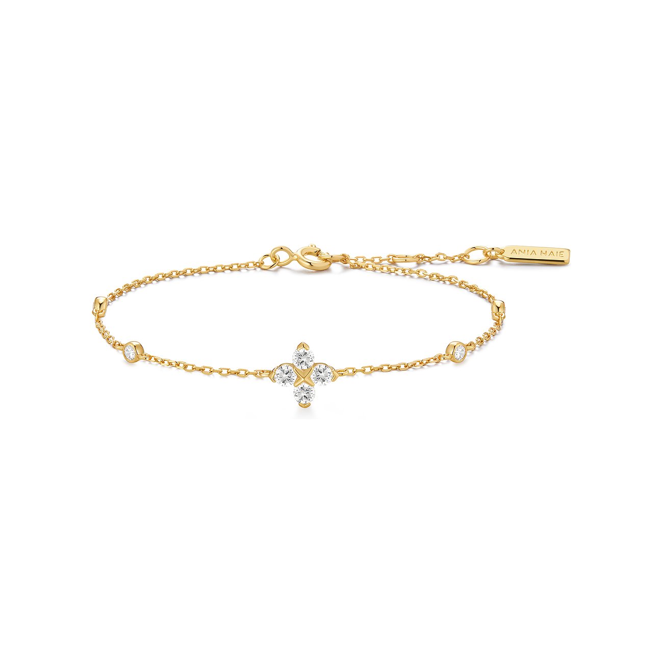 Ania Haie armband van verguld 925 zilver met zirkonia, een vierbladige klaver van vier stenen in het midden.