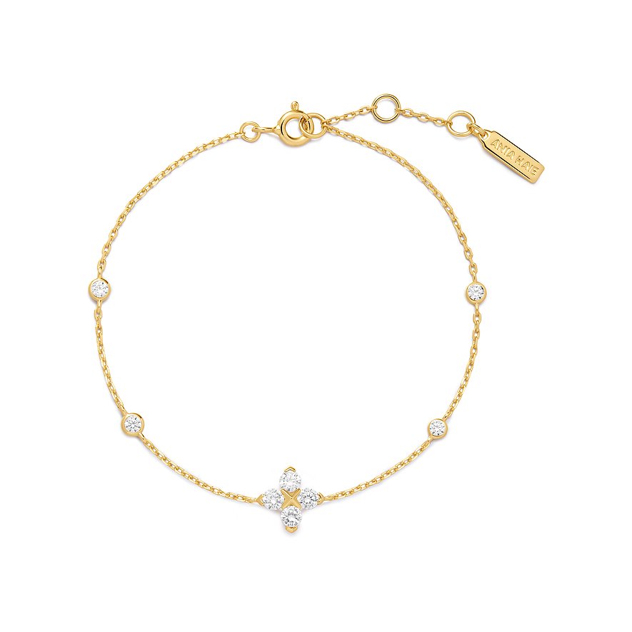 Ania Haie armband van verguld 925 zilver met meerdere zirkonia's en een klaverhanger.