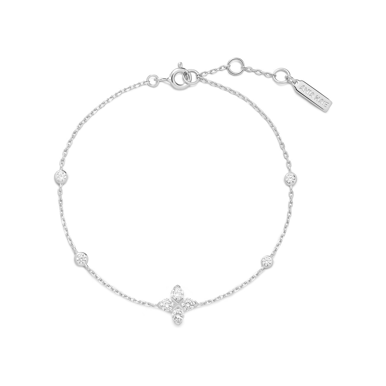 Ania Haie Armschmuck aus Silber, besetzt mit funkelnden Zirkonia in einer Blütenform und als einzelne Steine.