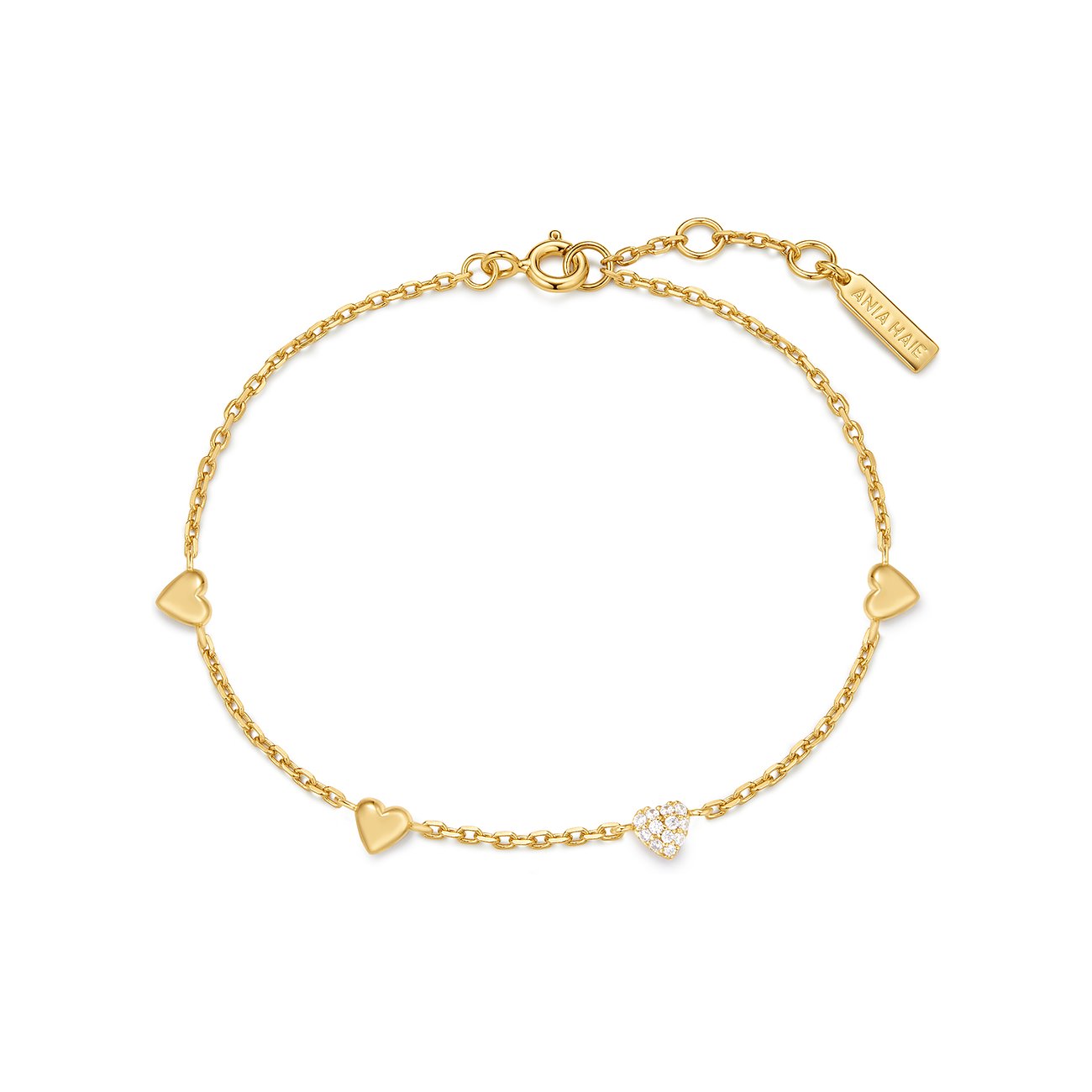 Bracciale Ania Haie in argento placcato oro con tre cuori, uno con zircone scintillante.