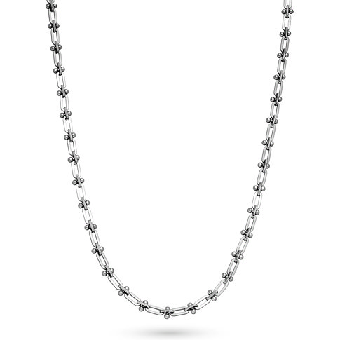 Una collana Liebeskind in acciaio inossidabile con struttura a maglie e piccoli connettori sferici.