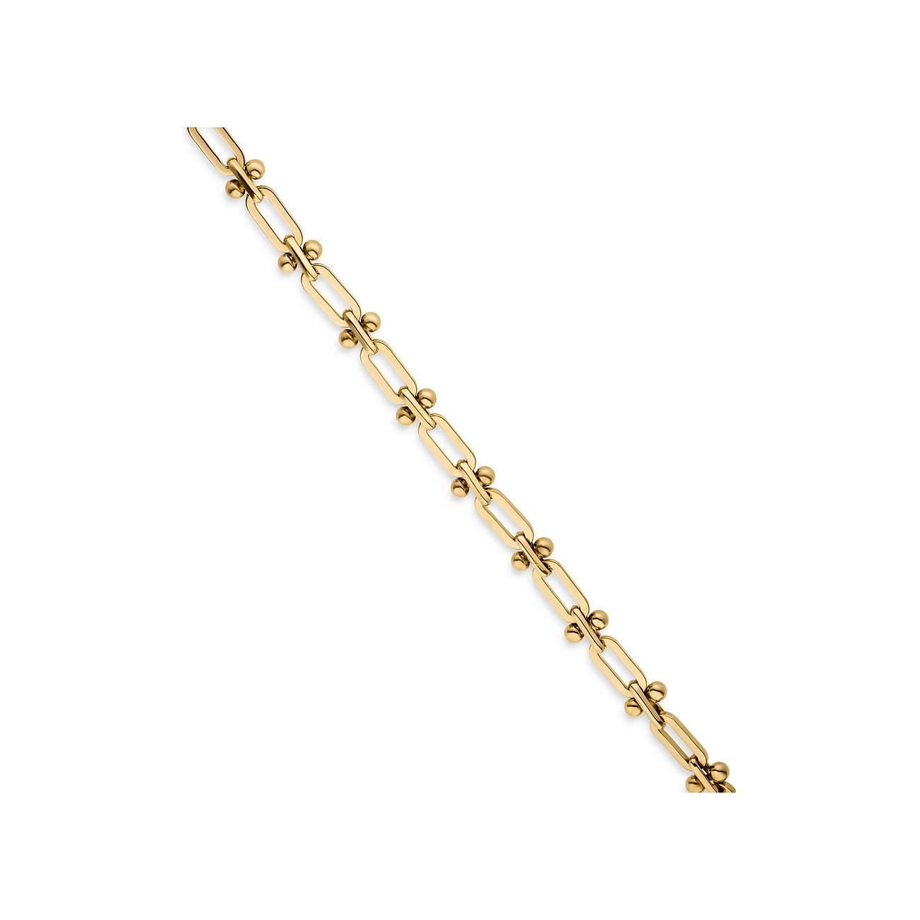 Liebeskind armbånd af guldbelagt rustfrit stål med små kugler og aflange led.