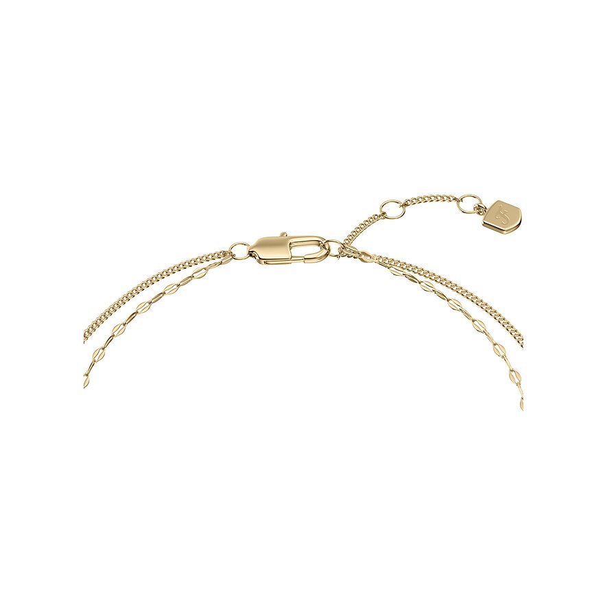 Nahaufnahme des Verschlusses eines goldenen Fossil Edelstahlarmbandes mit Verlängerungskette und herzförmiger Plakette.