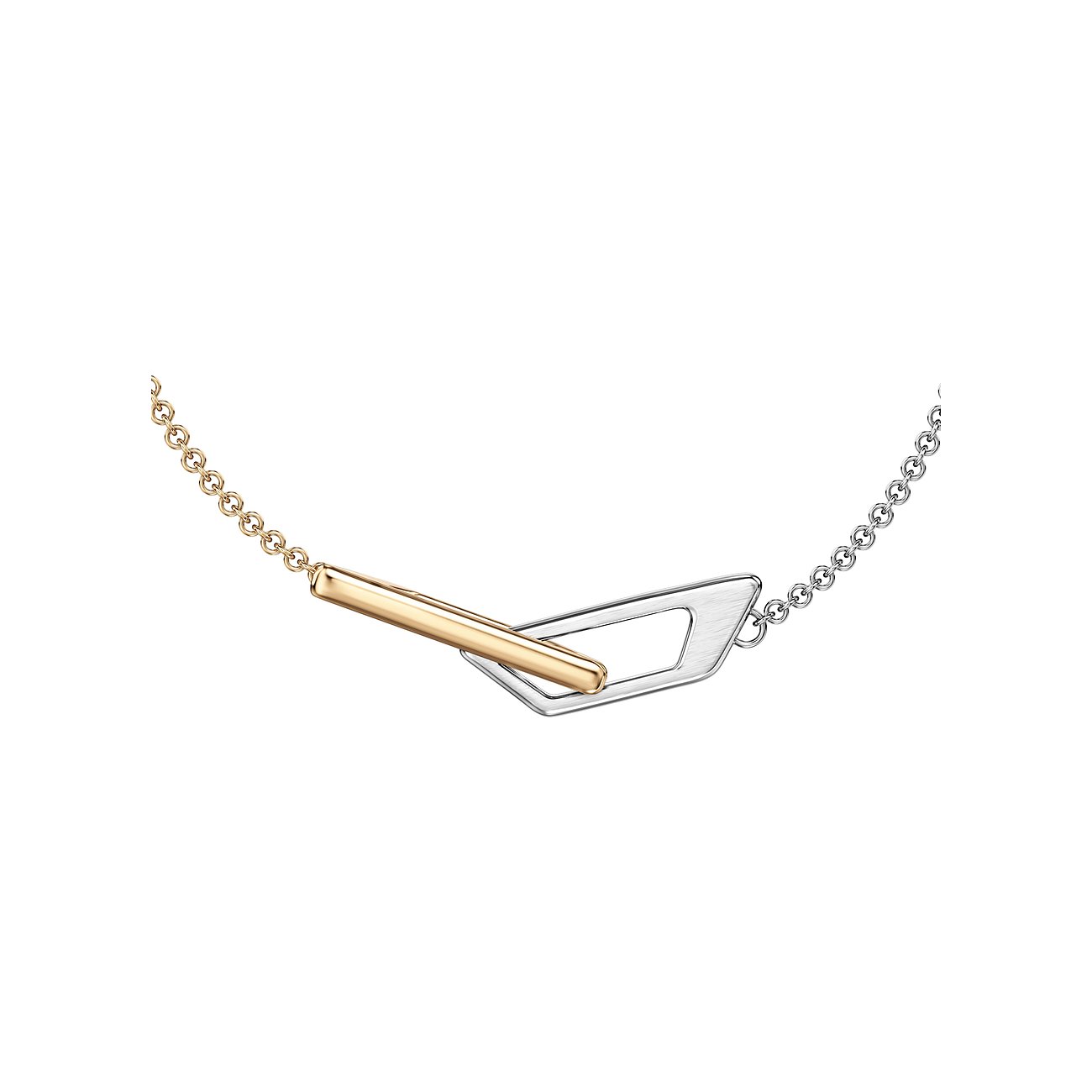 Diesel Armschmuck: goldene und silberne Ketten. Goldener Stab durch silbernes, geometrisches Element gefädelt.