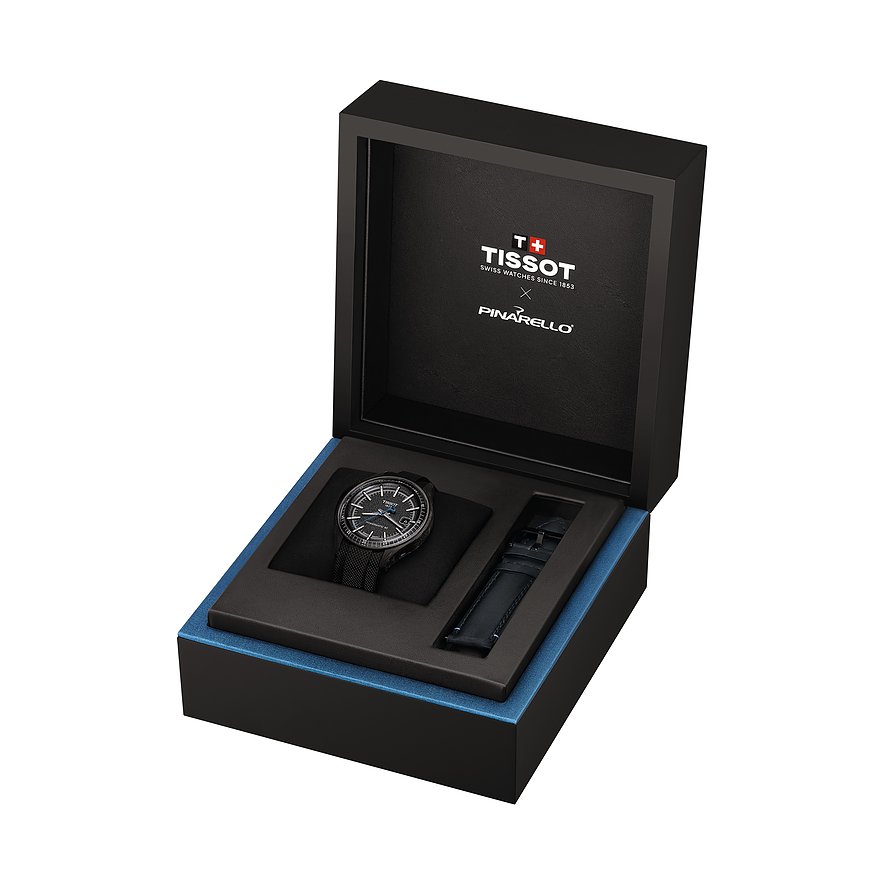 Die Tissot Herrenuhr aus Edelstahl in einer offenen Geschenkbox liegend, mit einem zusätzlichen Armband.